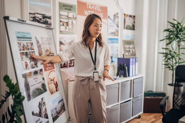 A travel agent working in a travel agency.
