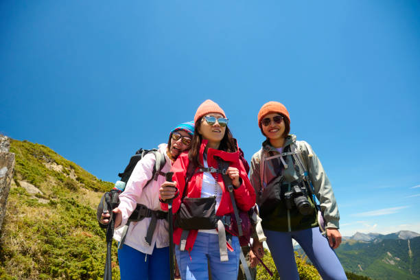 Group tour participants smiling and posing together at a popular landmark.